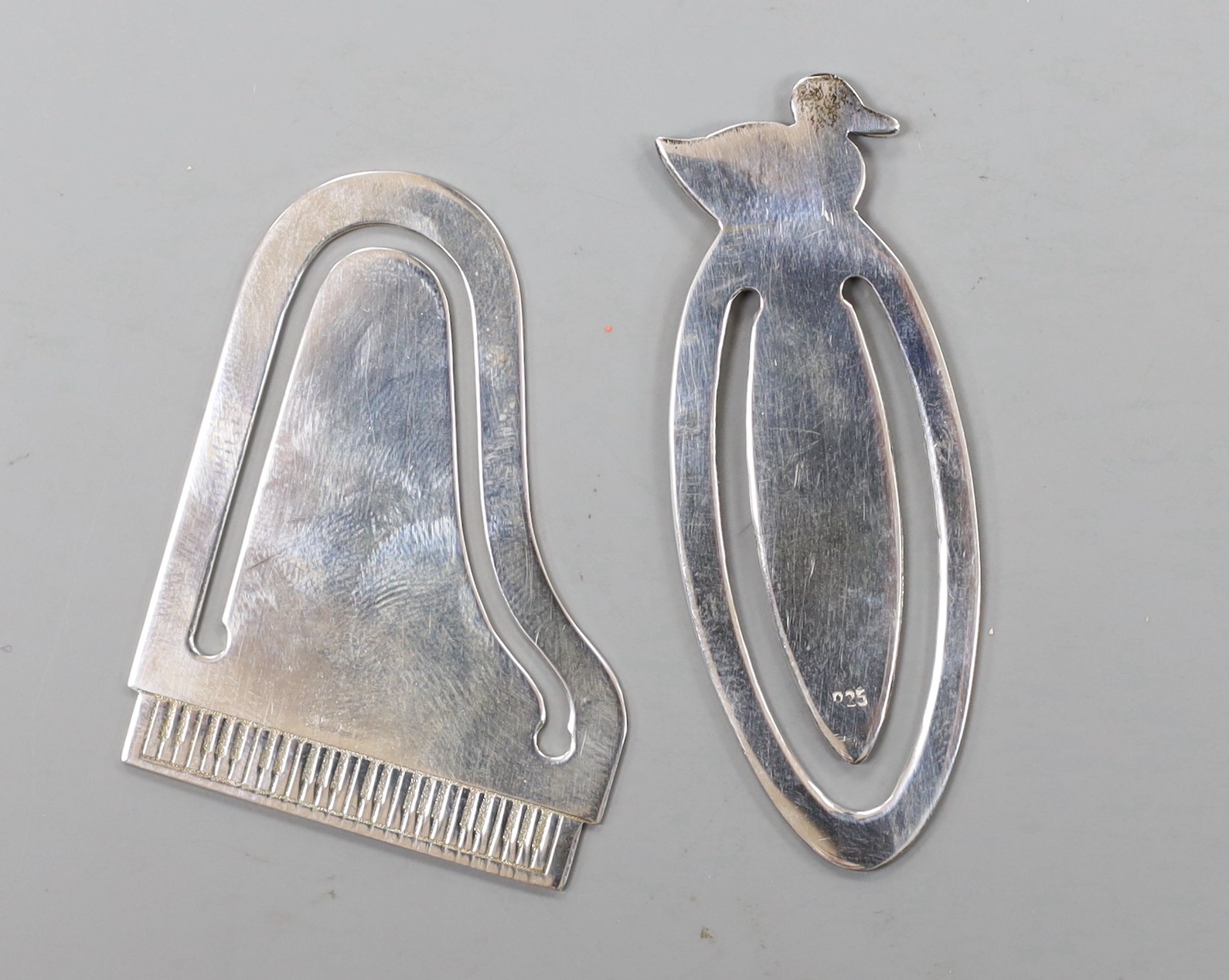 A modern Tiffany & Co 925 sterling commemorative bookmark, modelled as a grand piano and engraved ' Carnegie Hall 100 1891-1991, 47mm, with pouch and box and one other modern silver bookmark.